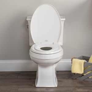 Front view of Little to Big built in potty seat on white toilet