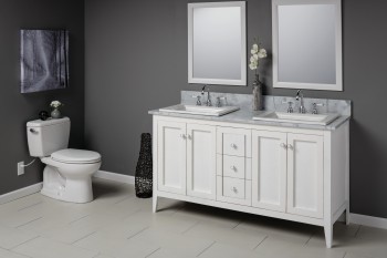 Bathroom setting with double white vanity and two mirrors next to a white toilet