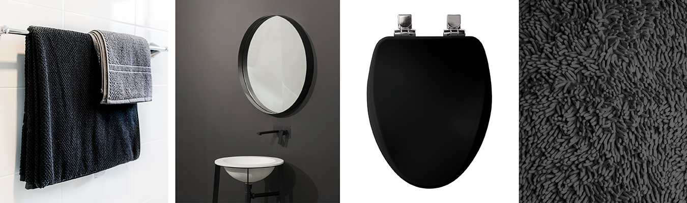 Black towels on rack, small white sink under round mirror, Bemis black toilet seat and swatch of dark towel
