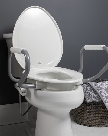 Lifestyle image showing the Assurance with Personal Wash Bidet in a bathroom setting. 